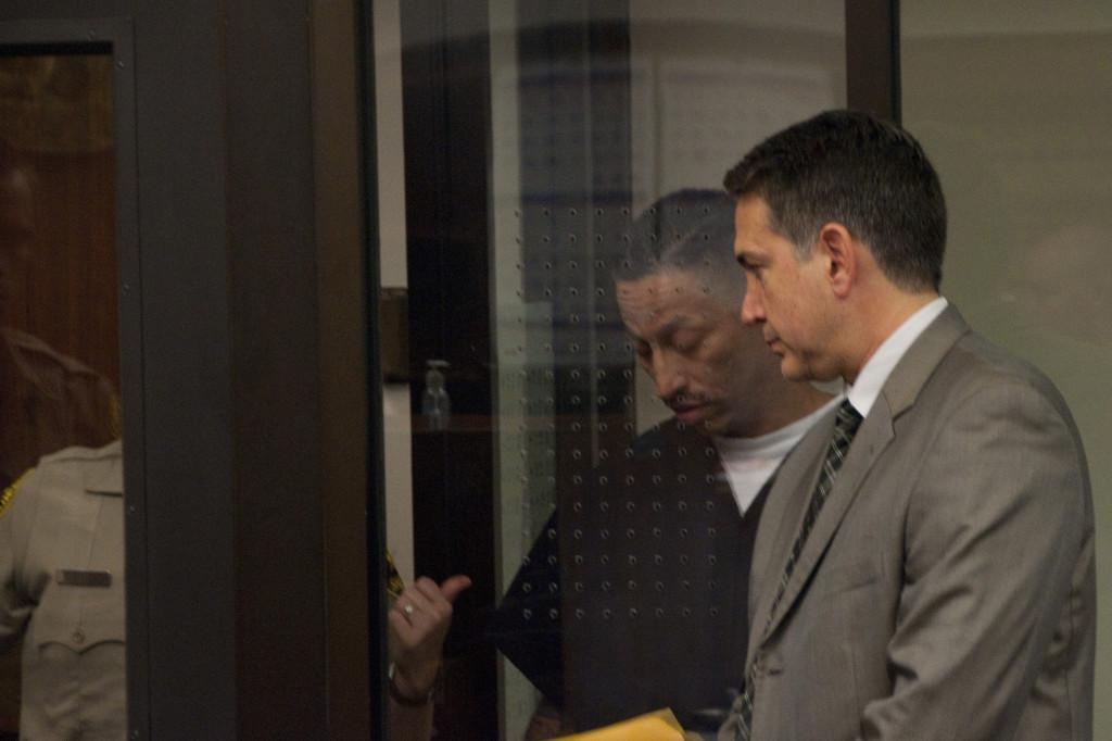 Perez (left) speaks with his attorney at his arraignment on Feb. 21 at the San Diego superior courthouse.- David L. Wells, City Times