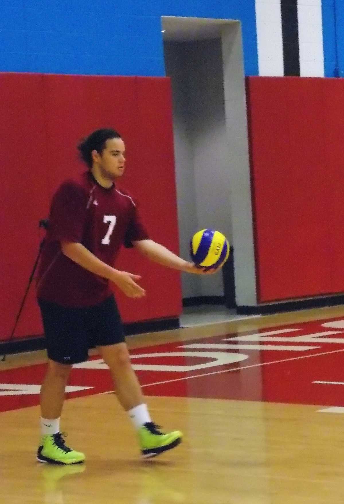 Knights volleyball player Rafael Garcia prepares to serve the ball during their home game against Mesa College on March 1, resulting in a loss of 0-3.