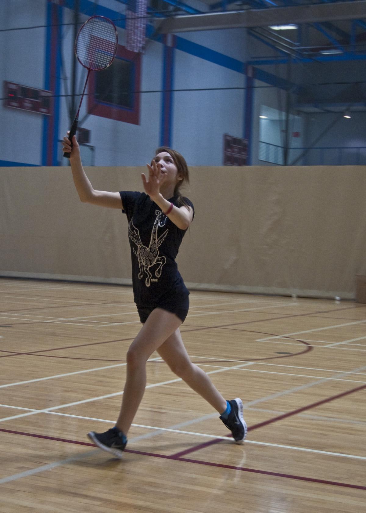 Player from the womens badminton team goes for the birdie during practice April 11 at the Harry West Gym. Audrey Brewer, City Times
