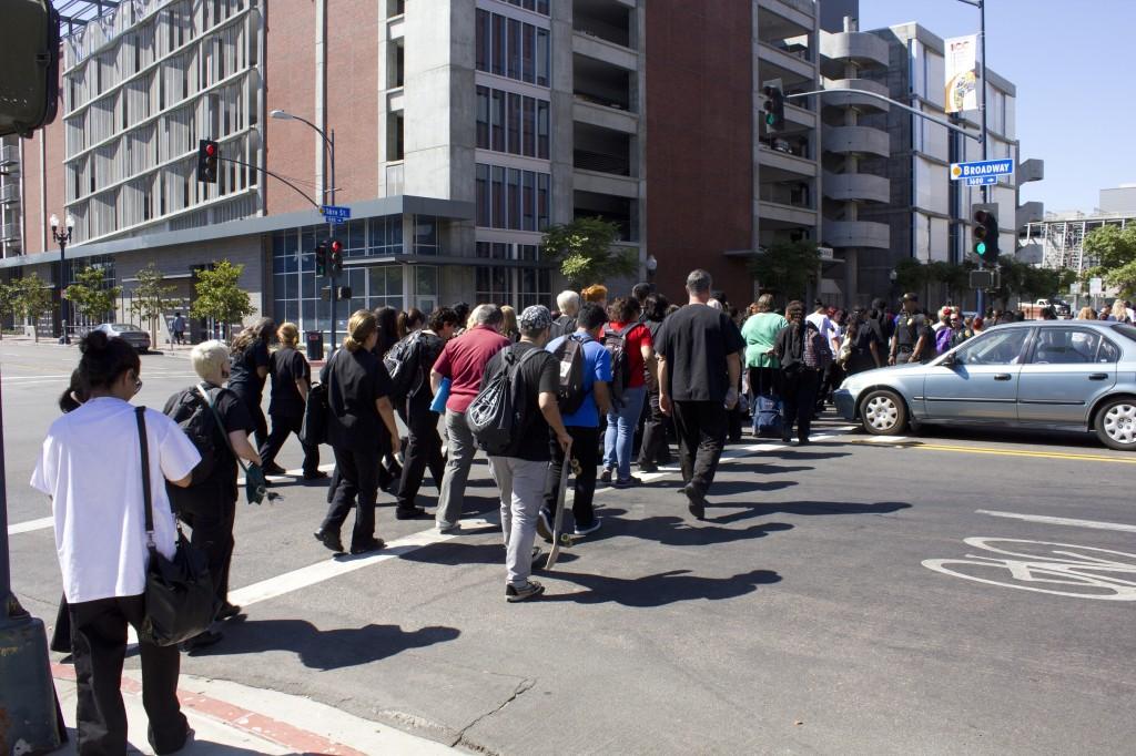 Campus officers direct pedestrians making their way back to the campus along 16th Street shortly after the alarm stopped on Thursday afternoon in the V Building. Mary Watson, City Times.
