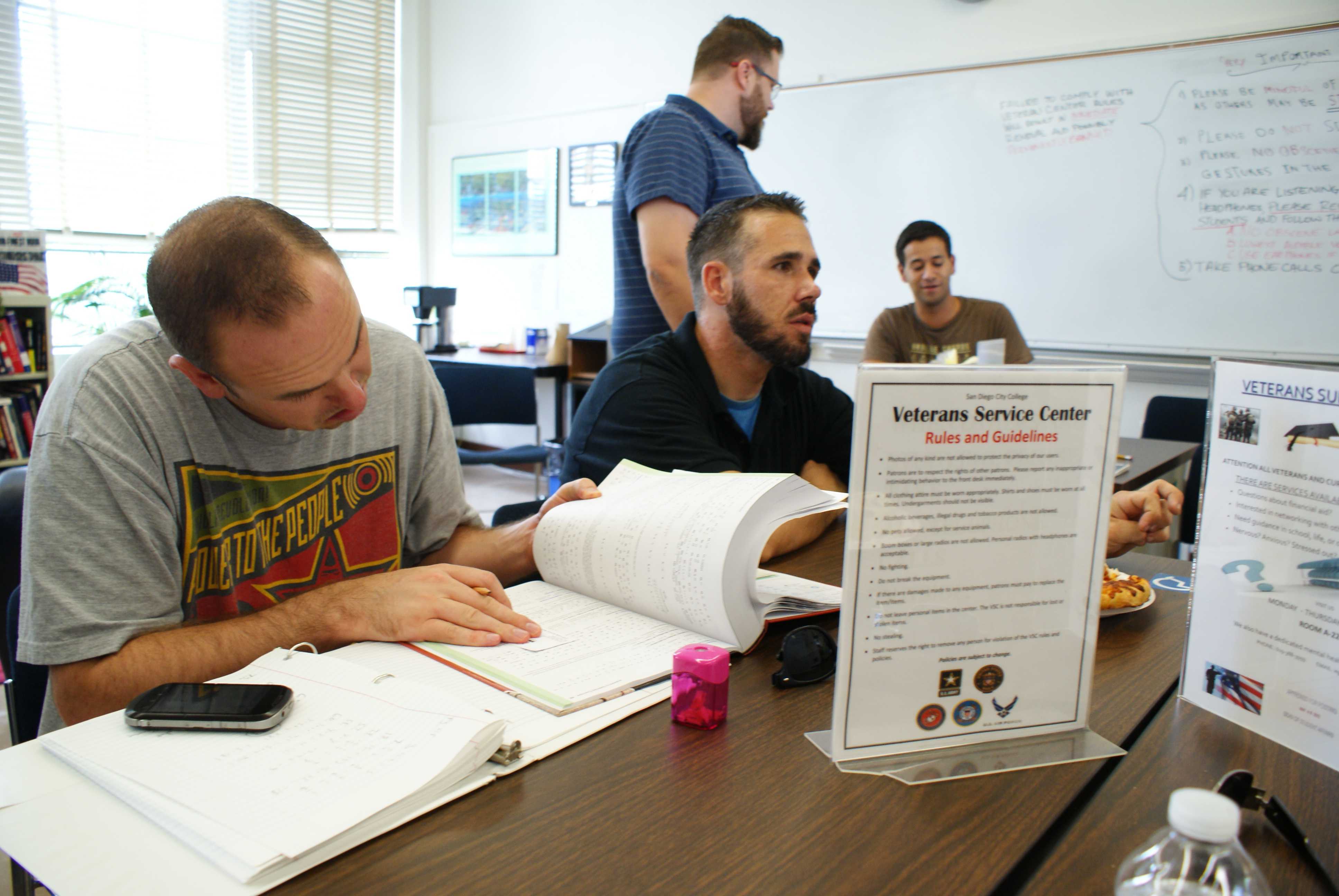 Peer counselors discuss some of the new services that will be available to student veterans this semester during a meeting at an open house event on Aug. 29. Torrey Spoerer, City Times.