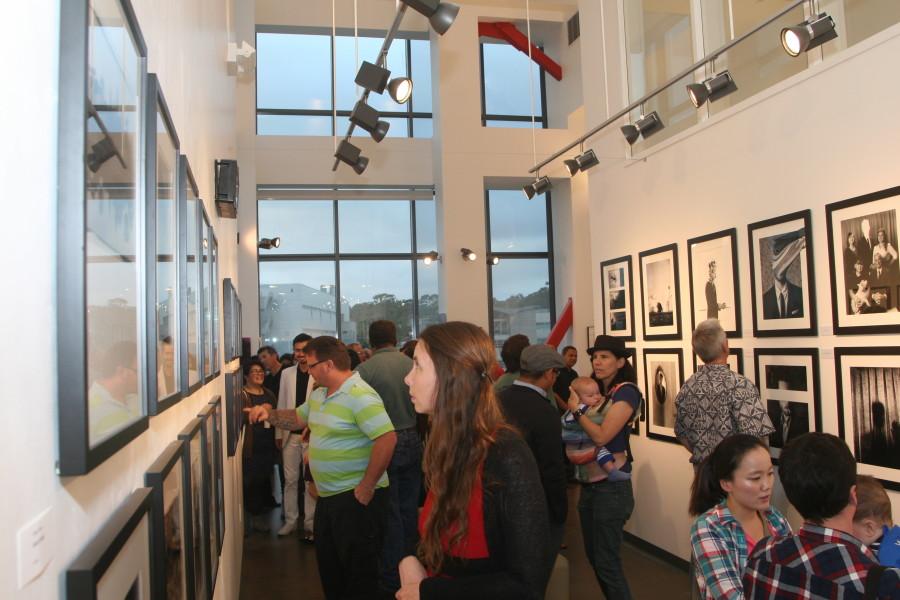 Guests enjoyed the portfolios of City students, including Edward Honakers works titled Depression, right wall. Photo credit: Edwin Rendon