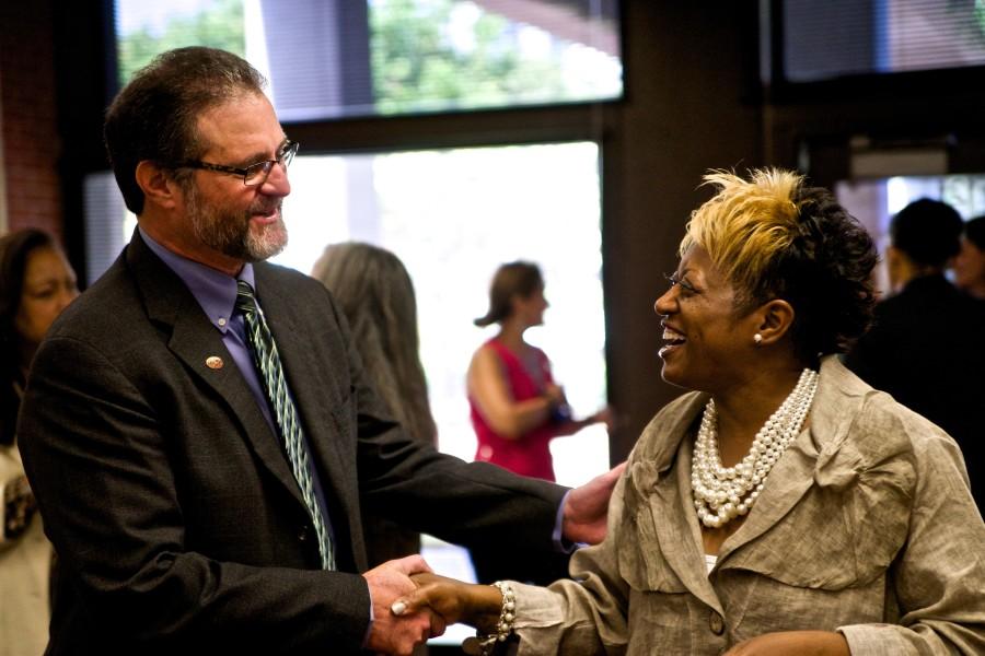 City College President Anthony Beebe speaks with cosmetology instructor Patricia Grooms-Jones  at  an Aug. 4 mixer introducing Beebe to faculty and staff. Photo credit: Troy Orem