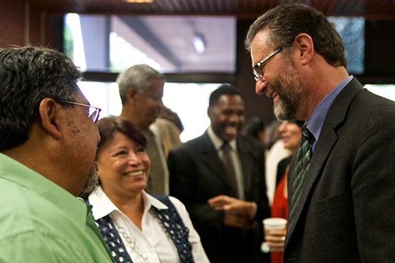 San Diego City College President Anthony Beebe greets teachers and staff at an Aug. 4 mixer. Photo credit: Troy Orem