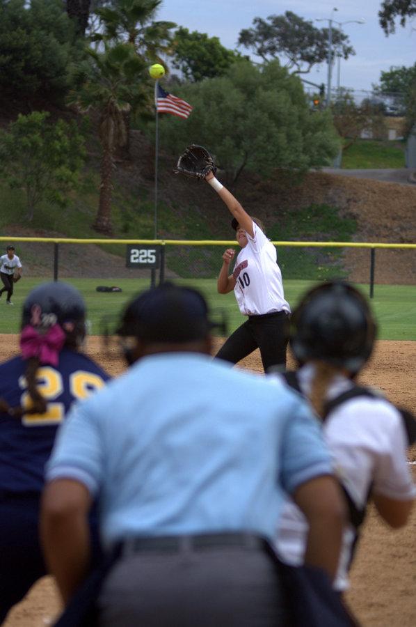Mesa College freshman Sabrina Gonzalez hits the ball over San Diego City College freshman pitcher Micela Ross during the seventh inning of the game, where the Knights lost 7-2 against the Olympians on March 11 at the Betty Hock Softball Field. Photo credit: David Pradel