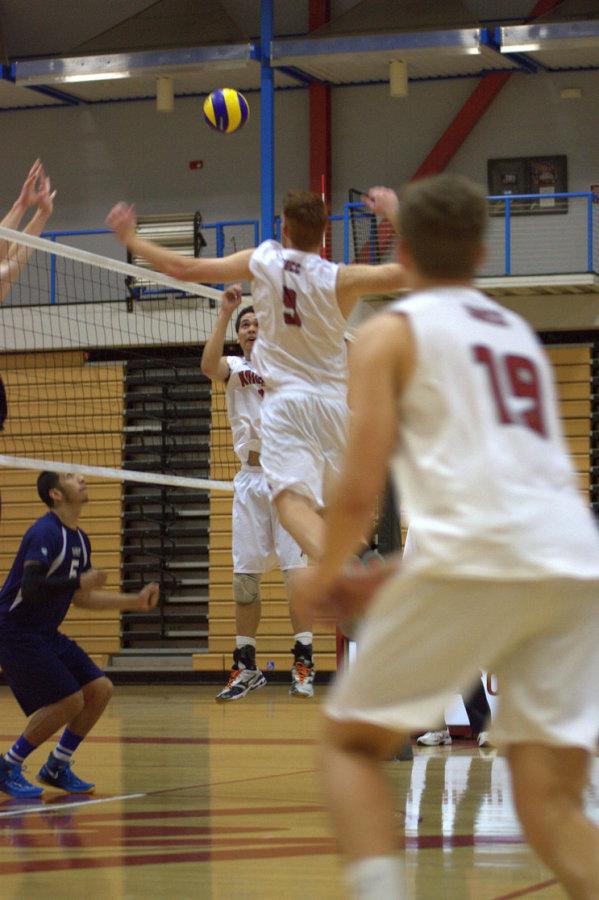 During the home opening match on Feb. 13, freshman middle blocker Zach Kramer goes up to send a hard hitting kill to the defense of El Camino College in the Harry West Gym. Photo credit: David Pradel