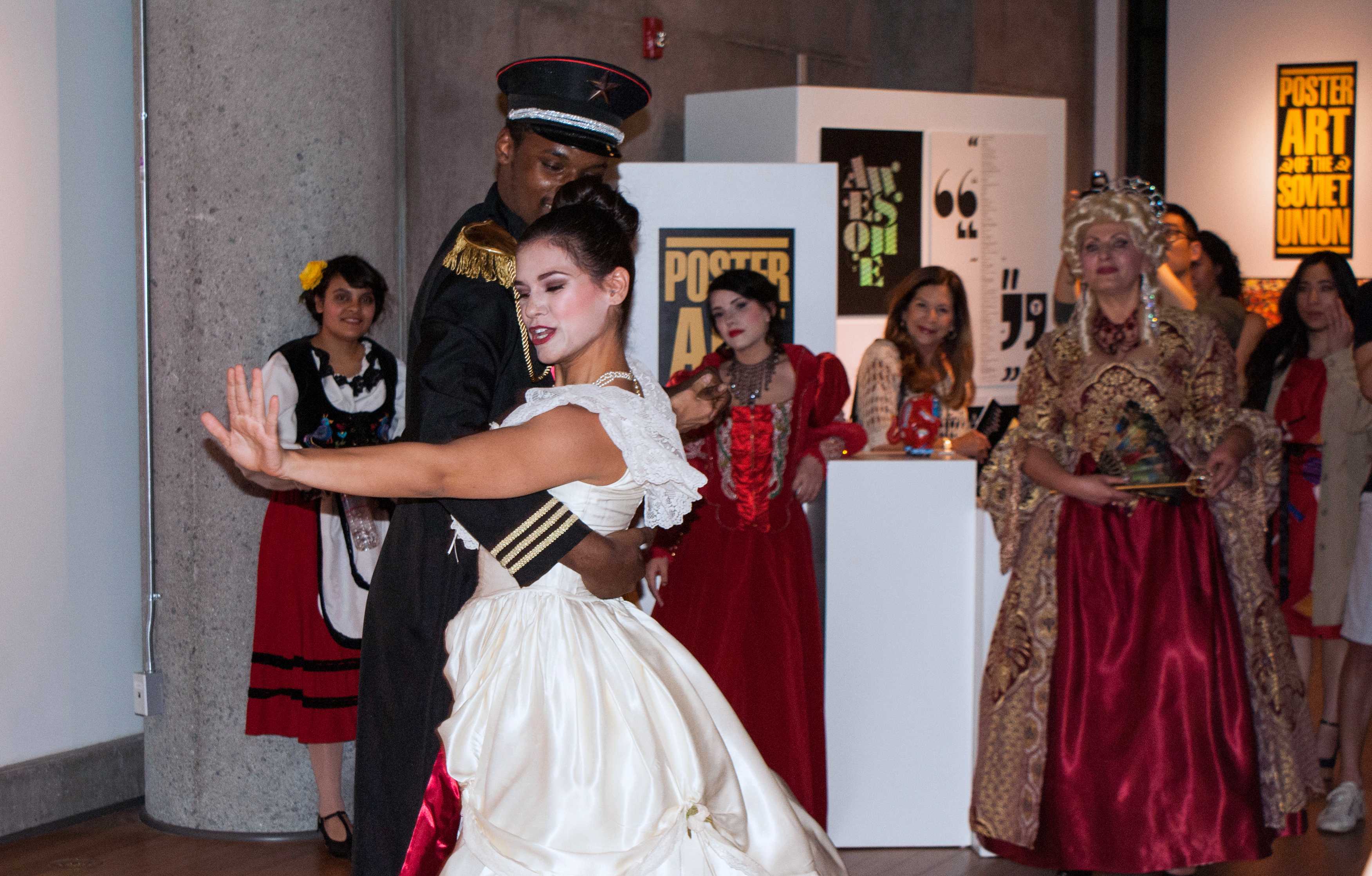 City College dancers Dante Finch and Brianna Bellamy perform a traditional Russian waltz in the center of the City Gallery as part of the opening reception for the gallery’s newest exhibition, “Dialogues: Poster Art of the Soviet Union,” on March 13. Photo credit: Torrey Spoerer