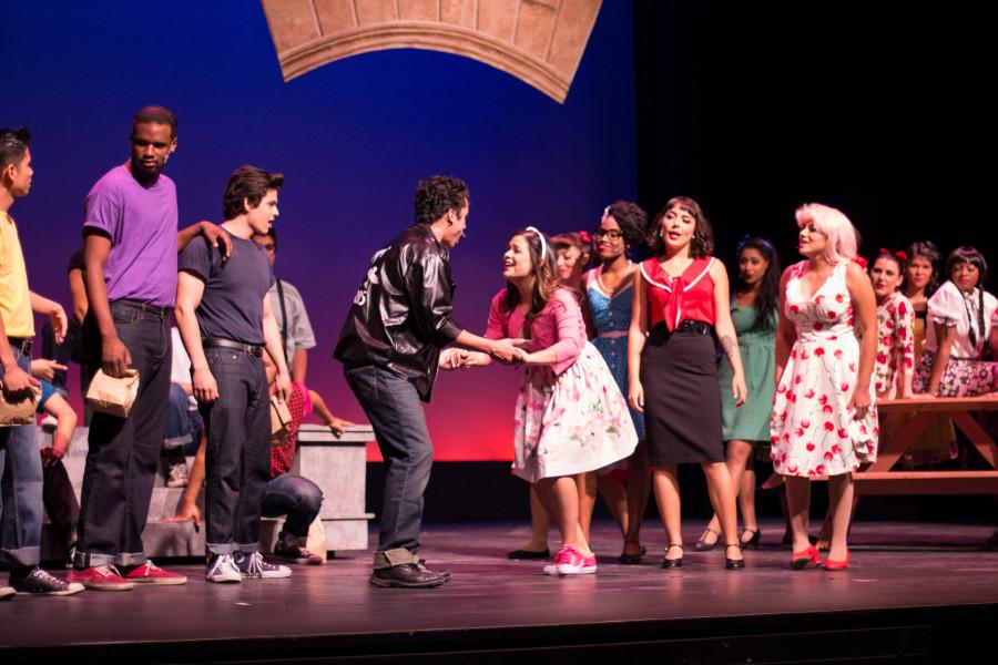 Cast members of the musical “Grease” sing and dance to multiple songs on opening night April 10. The musical will run until April 26  at the Saville Theatre. Photo credit: Torrey Spoerer