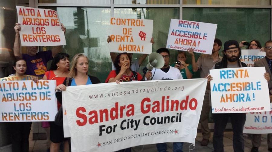 Surrounded+by+protesters+and+campaign+supporters+from+the+San+Diego+Socialist+Campaign%2C+Sandra+Galindo+%28center%29+speaks+at+a+renters+rights+rally+on+Sept.+21+in+City+Heights.++++Official+Facebook+photo