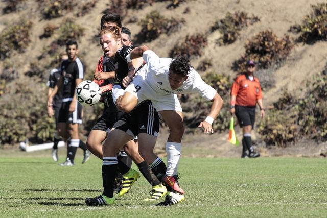 Knights sophomore midfielder Jose De Silva (left) battles  sophomore forward Sylvester Rivera (right) to get control of the ball on Oct.7 at San Diego City College soccer field. Photo credit: Celia Jimenez