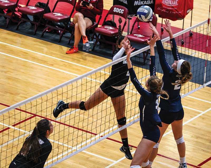 Knights+outside+hitter+Lysette+Serna+goes+up+to+tap+the+ball+over+the+defenders+from+Pima+Community+College+during+the+volleyball+tournament+Sept.+24+at+West+Gym.+Photo+credit%3A+David+Pradel+%2F+Newscene+Contributor