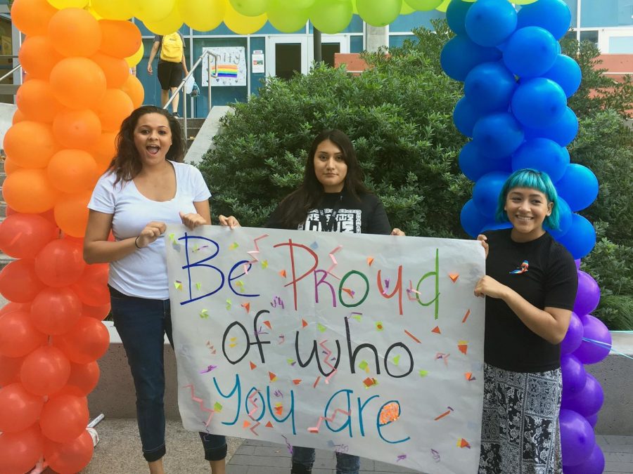 ASG President, Susy Molina (middle) with club members holding poster promoting on National Coming Out Day on Oct. 11, 2017. 
