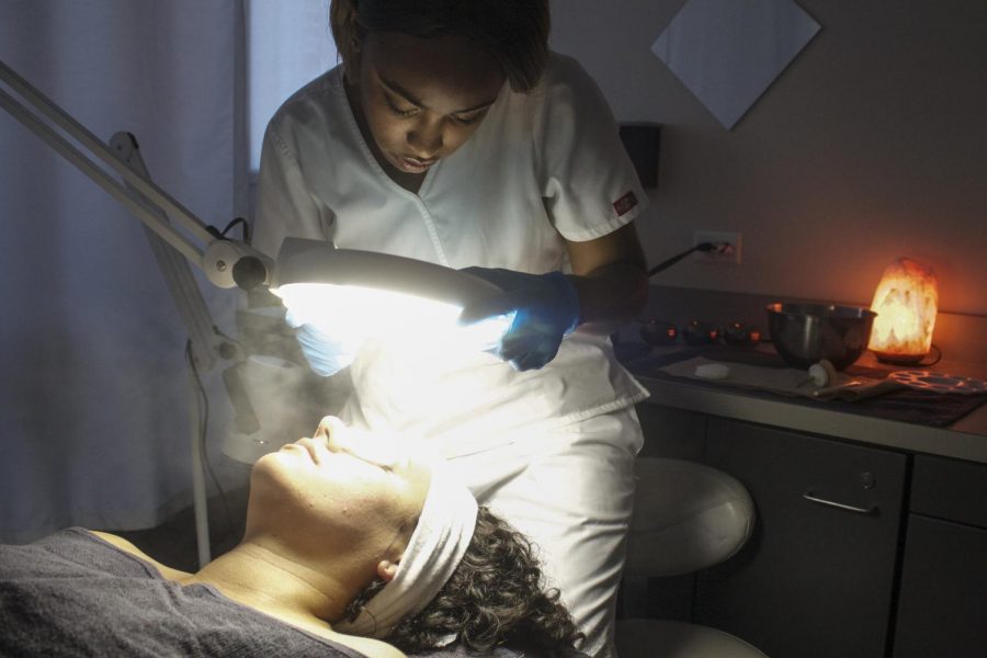 Kameal Thomas provides skin treatments as part of a hands-on esthetics program. 