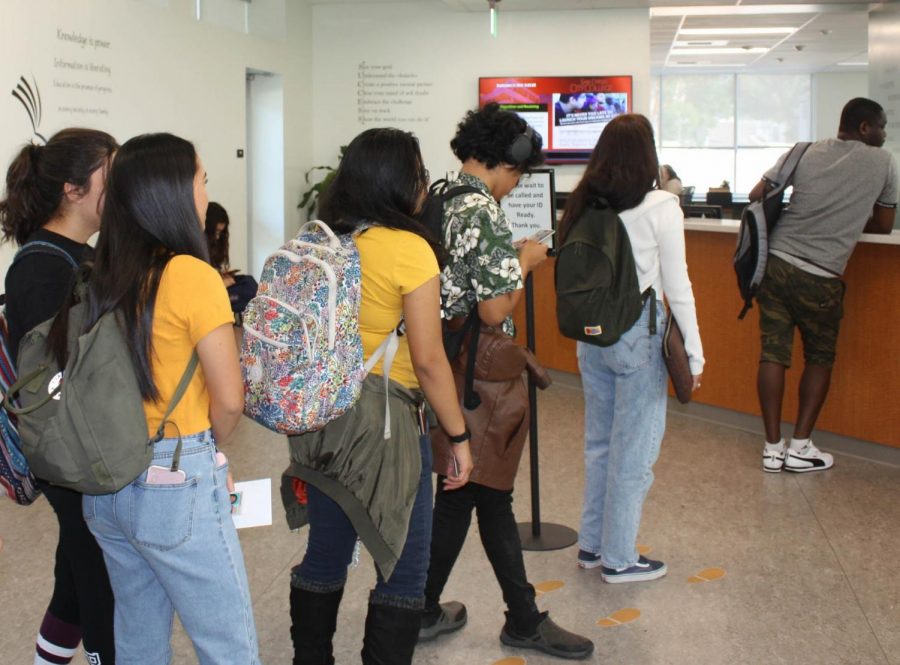 City College students wait in line in the financial aid office.