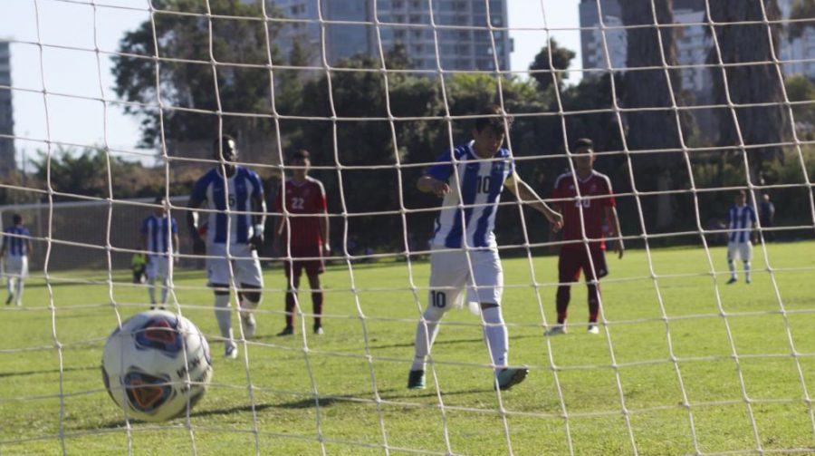 A Cerritos College mens soccer player scores a goal on a penalty kick against the Knights.