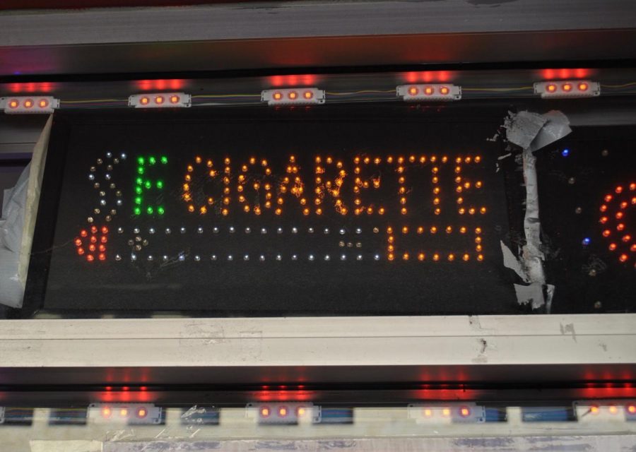 A lighted sign advertises E Cigarettes.