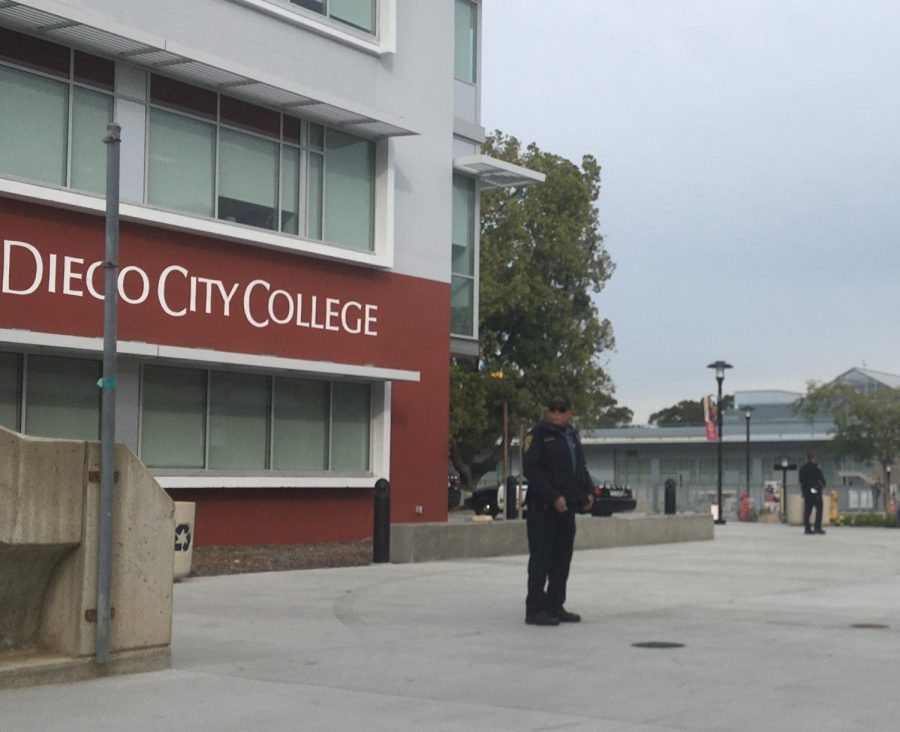 A San Diego City College police officer keeps watch outside of the A building.