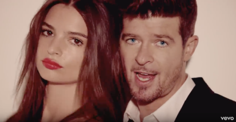 Robin Thicke singing Blurred Lines in the music video.