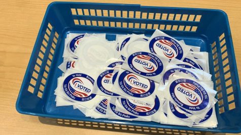 "I voted" stickers in a blue basquet.