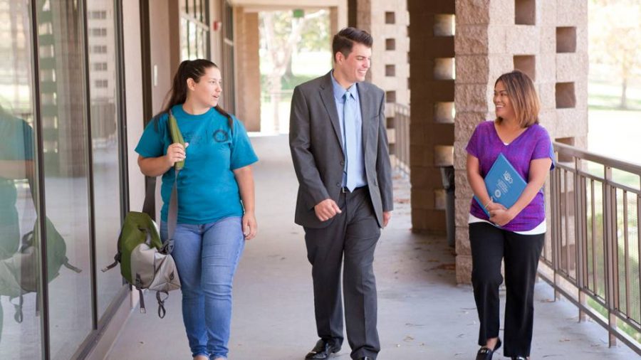 Carlos Turner Cortez, one of the four finalists for SDCCD chancellor, walks with students in this undated photo. SDCCD photo