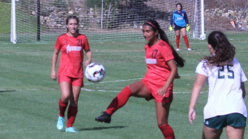 City womens soccer team playing on the field against Grossmont