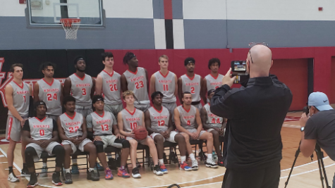 Knights men’s basketball preparing for team pictures at the last practice before their season starts.