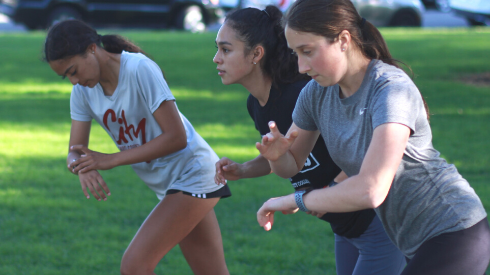 Pictured Right to left: Rachel Karalnik, Mariana Lara Pantoja, and Natalie Garcia start off into run preparing for before their State championship bid.