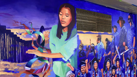 A portion of the mural Alicia Siu is painting in the City College cafeteria showing a Kumeyaay woman