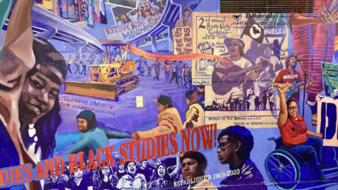 A portion of the mural in the City College cafeteria is shown, including a bulldozer topped by a man with raised fist, and figures singing, playing guitars and involved in other protests and activities.