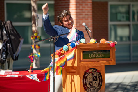 Angel Lopez, a City student involved in the colleges theatre program, raises his fist in celebration during the Lavender Graduation ceremony on May 12, 2022. City College Flickr