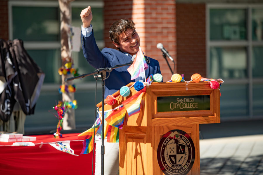 Angel Lopez, a City student involved in the colleges theatre program, raises his fist in celebration during the Lavender Graduation ceremony on May 12, 2022. City College Flickr