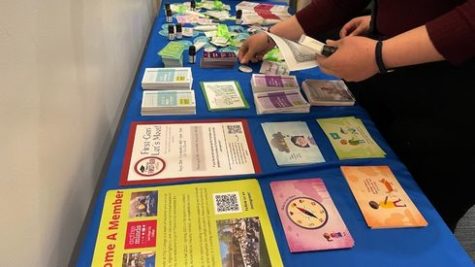 Attendees of the suicide prevention training at San Diego City College pick up mental health literature and self-care items at the City College suicide prevention training
