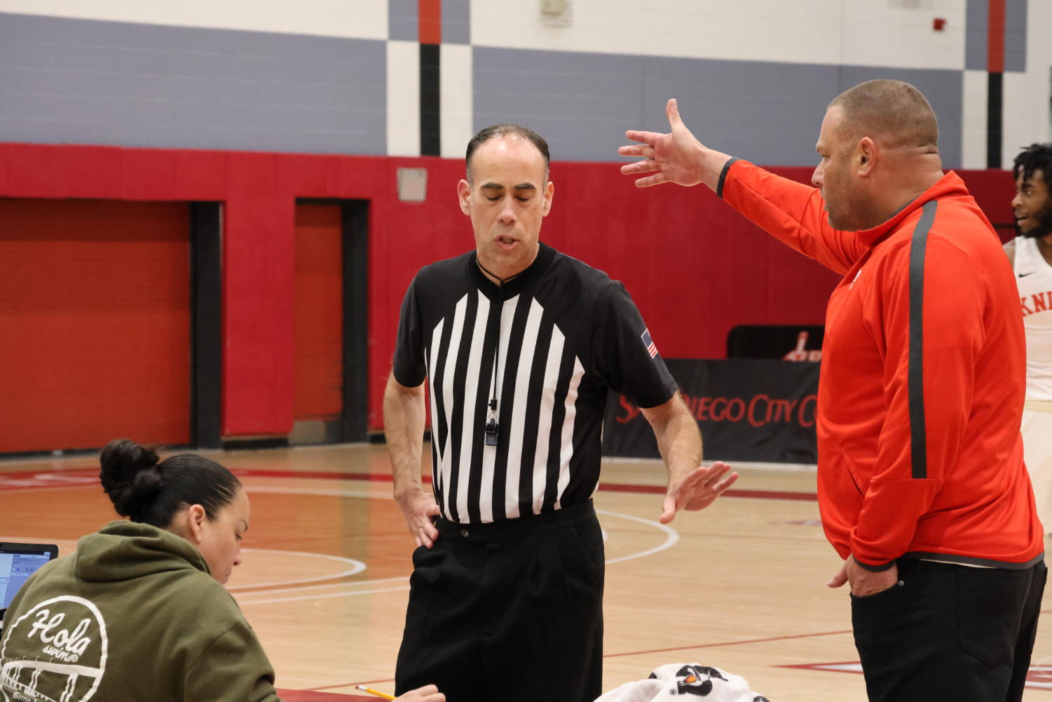 Knights coach Mitch Charlens, right, disputes a call with official Michael Rapp