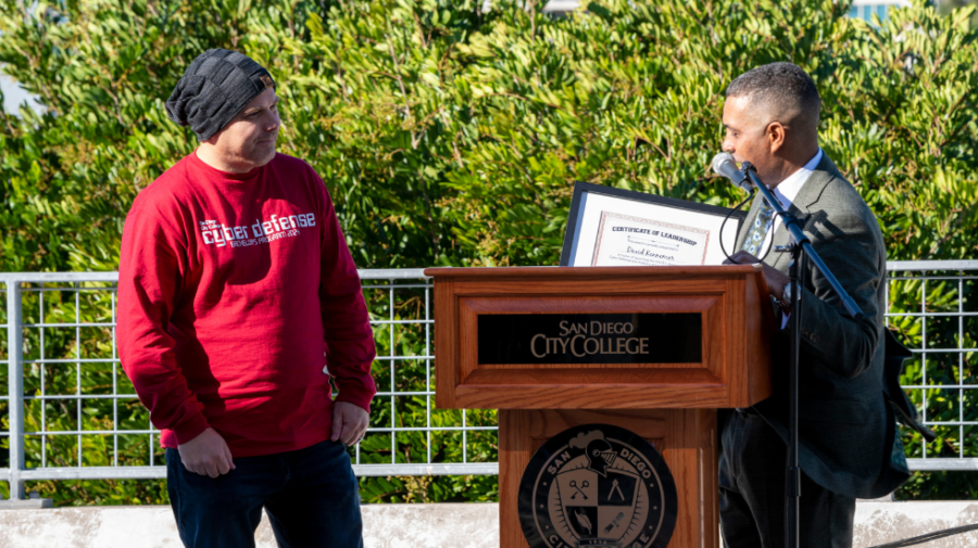 Professor David Kennemer (left), who spearheaded the cybersecurity bachelors proposal, receives an award from City College President Ricky Shabazz at the 2023 Convocation. San Diego City College Flickr photo