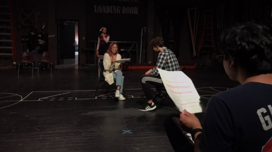 Jesus Sandoval, right, directing actors during rehearsals of The First Date