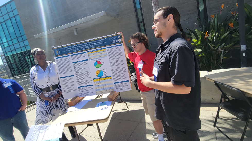 Psychology students Dylan Wikel, Nicholas Lazaris and Angelica Tharpe give a presentation at the San Diego City College Open House using facts and statistics to dismantle psychological myths, April 20, 2023. Photo by Shamere Grimes/City Times Media