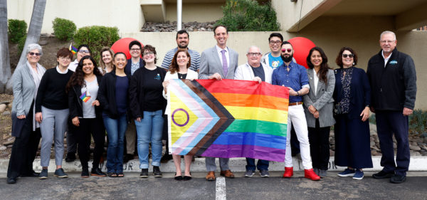 Chancellor Greg Smith, center, poses with SDCCD district office staff at the district's flag raising ceremony during June's Pride Month, Thursday, June 1, 2023. Photo courtesy of SDCCD Flickr