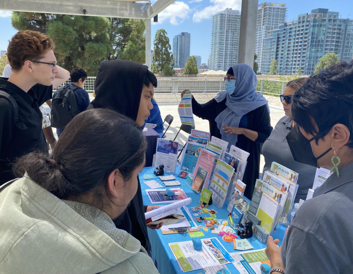 Students talk with representatives from the County of San Diego Health and Human Services Agency to learn about the services they offer, which include assistance to county benefits like CalFresh and Medicare, September 18, 2023. Photo by Eve McNally/City Times Media