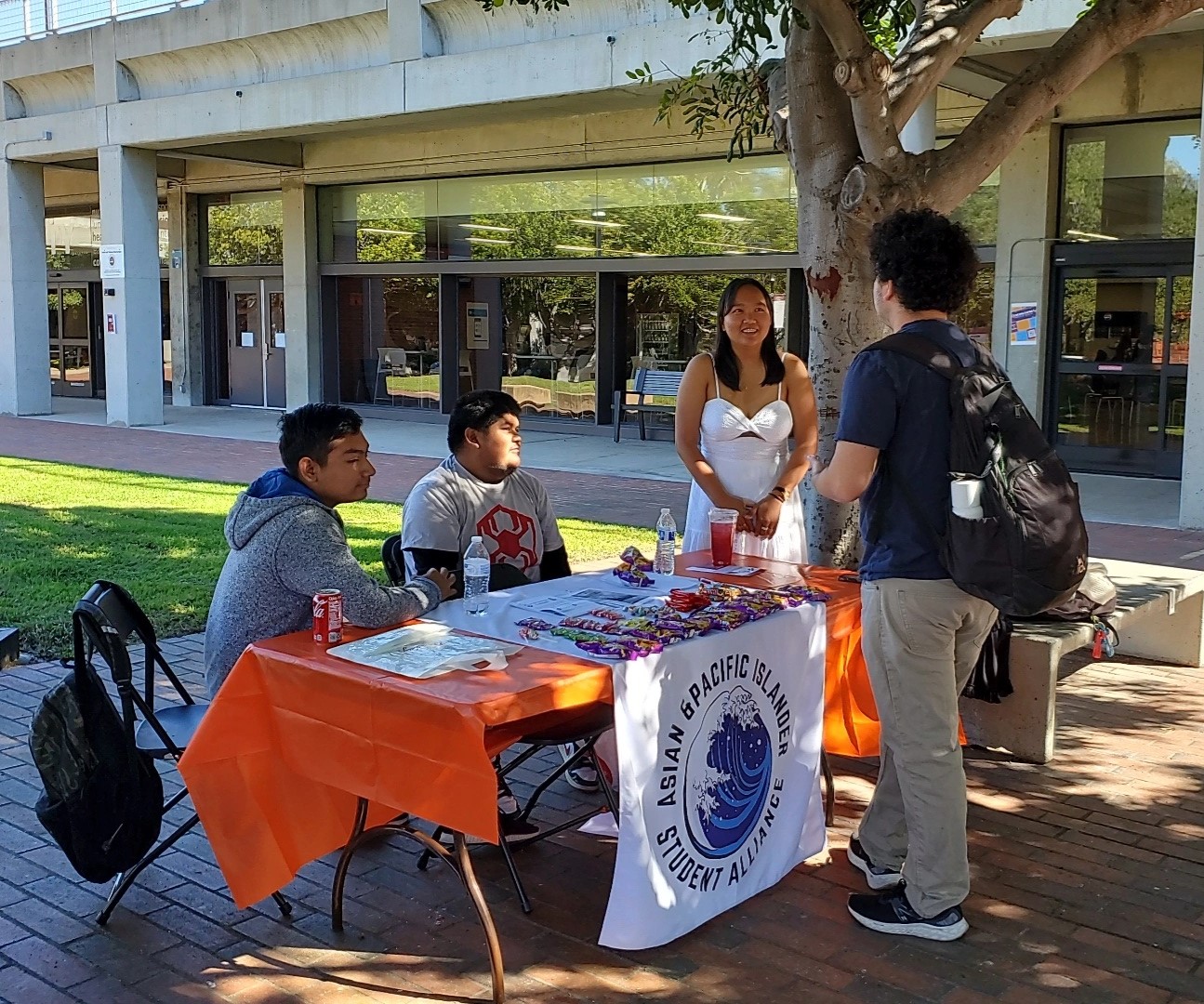Kimberly Codera, right, dressed as Corpse Bride, shares information about the Asian Pacific Student Alliance along with fellow club members, Armando Vazquez, left, and Jose Castrejon, center, Tuesday, Oct. 31, 2023. Photo by Kevin Ouellette/City Times Media
