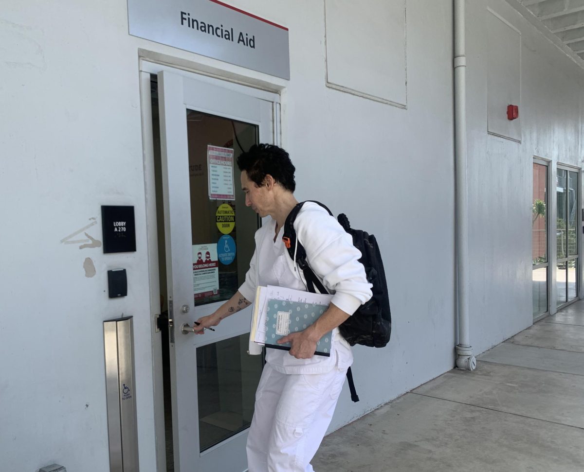 Jonathan Tyler, a student in the esthetician program, walks into the financial aid office to work on FAFSA, Thursday, Oct. 26, 2023. Photo by Keila Menjivar Zamora/City Times Media