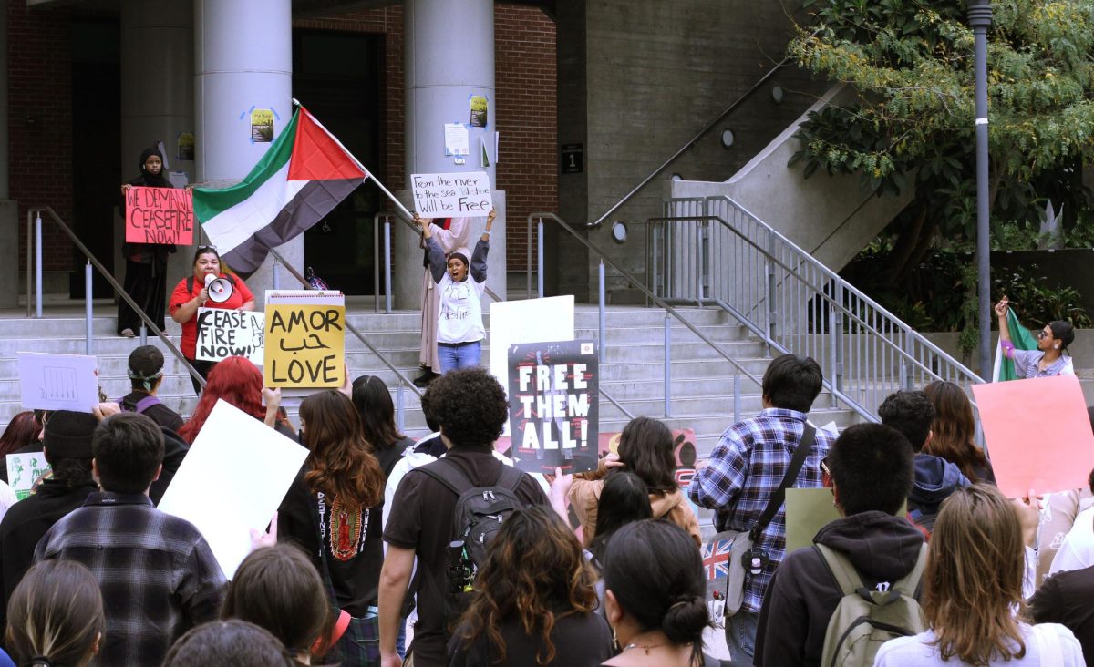 M.E.Ch.A member and event organizer, Vanessa, center, speaks into the bullhorn as she addresses the crowd at the national walkout for Palestine in San Diego City College, Wednesday, Oct. 25, 2023. Photo by Sean Monney/City Times Media