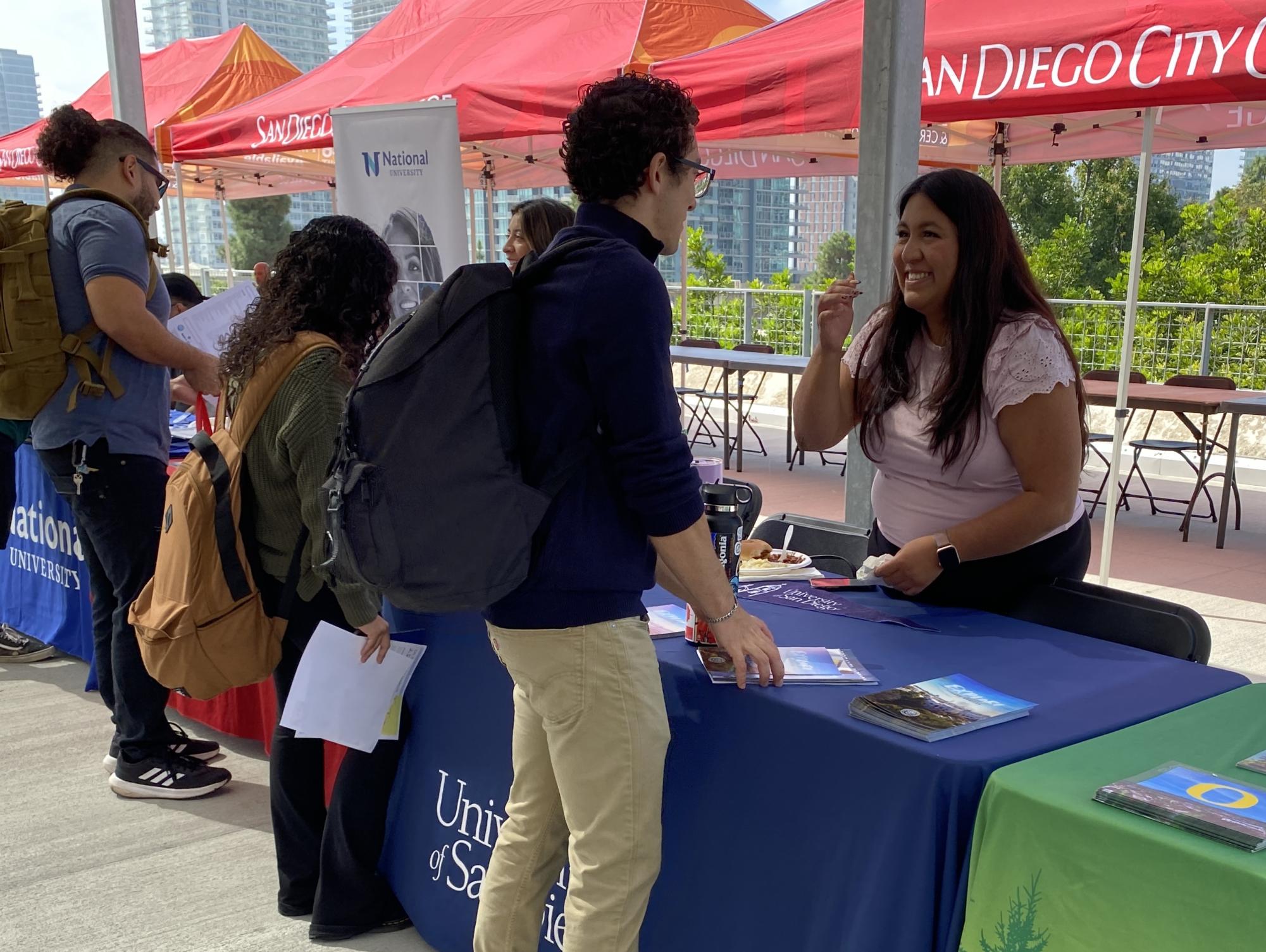 Tulculce Garcia, right, speaks to students about transferring to University of San Diego during the City College Fall Transfer Fair, Oct. 17, 2023. Photo by Luke Bradbury/City Times Media