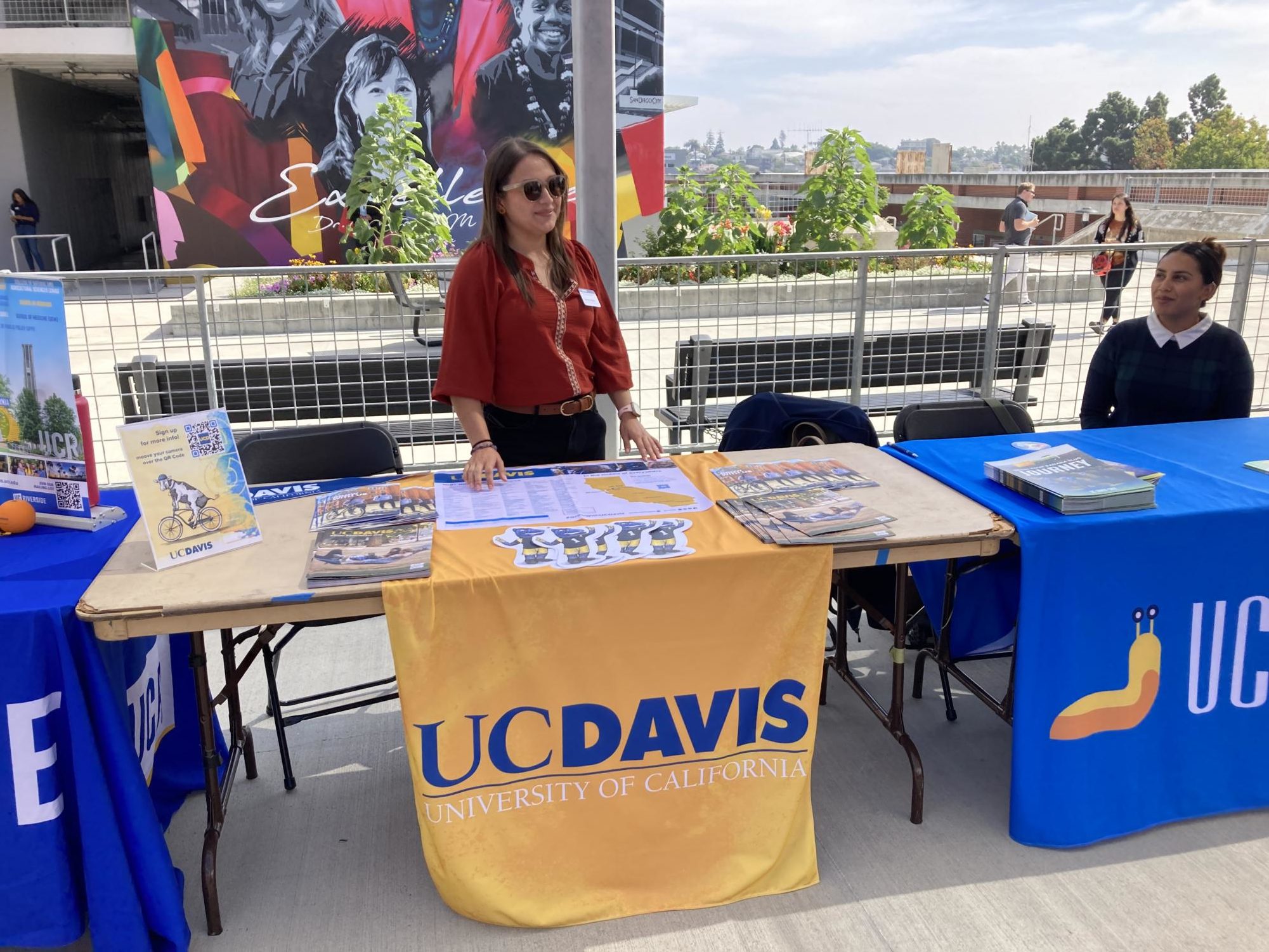 UC Davis Assistant Director Southern California Recruitment Vanessa Rojas tends to her table at the Fall Transfer Fair. Oct 17, 2023. Photo by Marco Guajardo/City Times Media