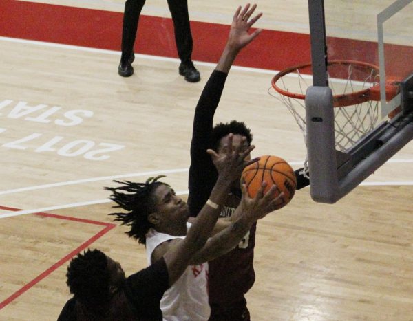 Sophomore starting guard KJay Bradley, center, puts up a shot against a pair of Southwestern College defenders at Harry West Gym, Wednesday, Feb. 7, 2024. Photo by Danny Straus/City Times Media