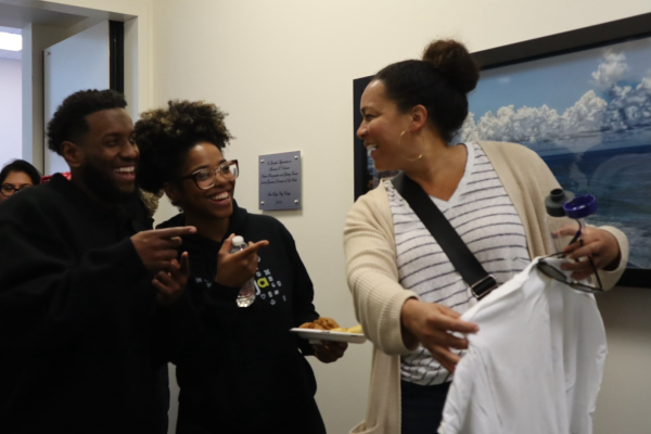 City College counselor Mohamed Musse, left, and Umoja president Tammy Williams, center, laughed with Erin Charlens, an Umoja coordinator and counselor, at the Black Excellence Meet and Greet, Thursday, Feb. 8, 2024. Photo by Nadia Lavin/City Times Media