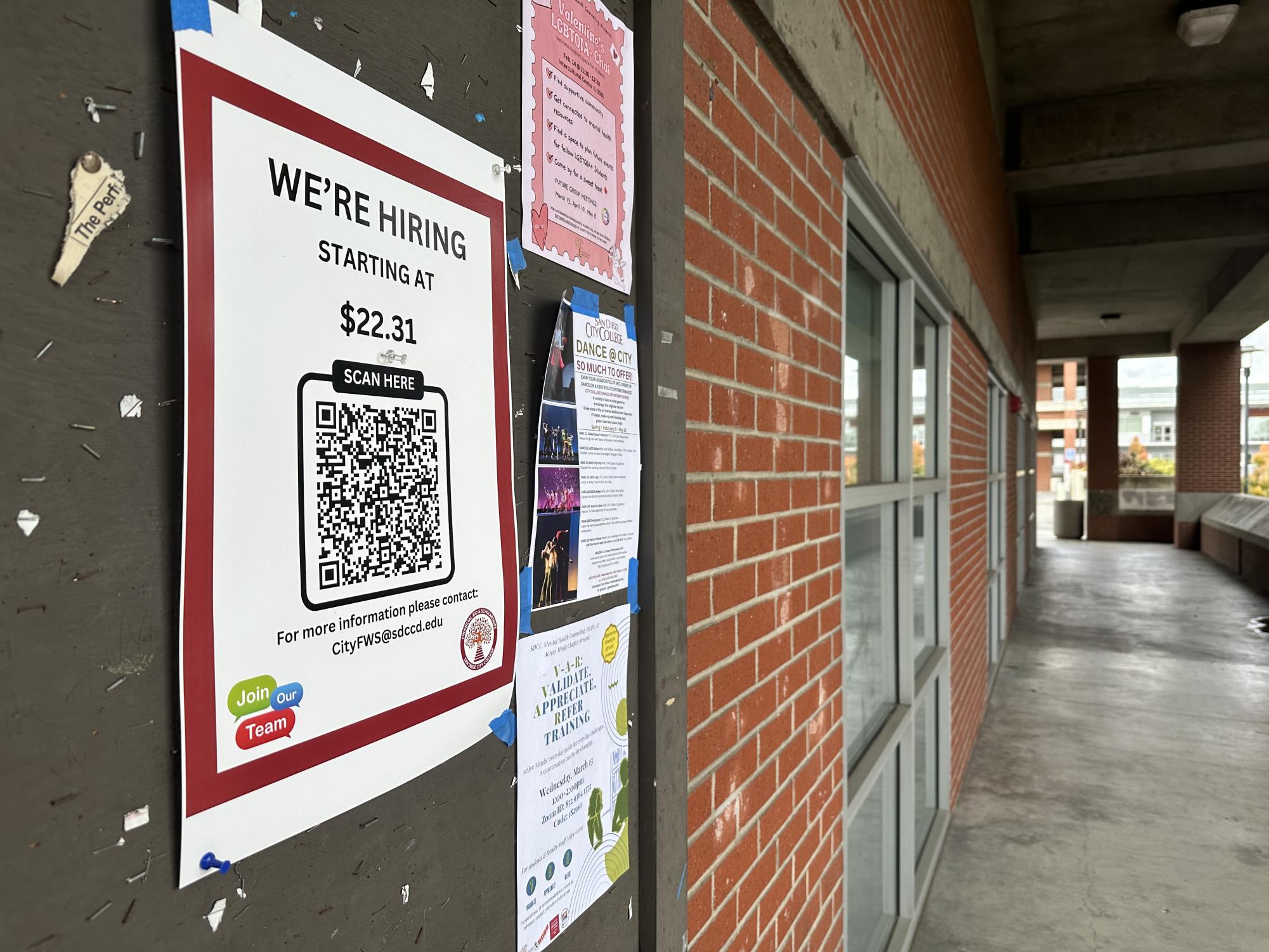 Hiring signs posted around City College campus advertising the new starting pay for hourly employees. Chancellor Greg Smith hopes increasing the minimum wage at the district will draw more high quality candidates to SDCCD. Photo by Bailey Kohnen/City Times Media