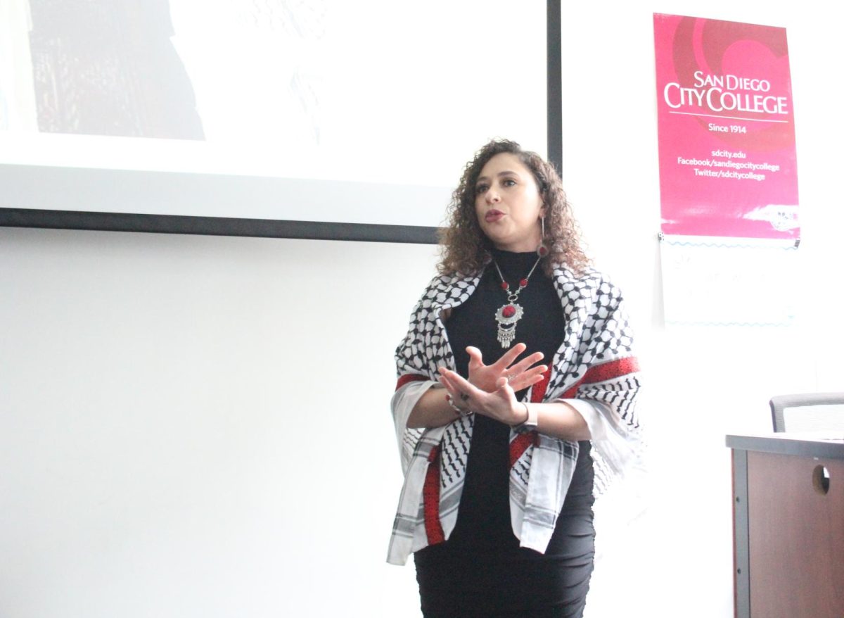 Artist Lorain Khalil Rihan explains her personal history at Resistance through Art and Poetry, an artist talk hosted by the World Cultures program at San Diego City College, Wednesday, Mar. 6, 2024. Photo by Susana Serrano/City Times Media