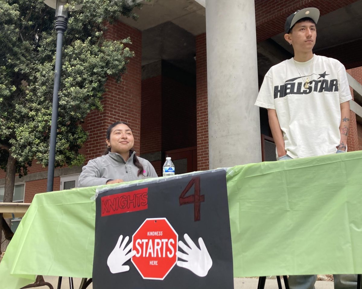 Knights 4 Change president Montse Vaquera, left, and treasurer Luis Herrera, right, tend to their club’s table at San Diego City College’s Club Rush, March 14, 2024. Knights 4 Change takes students downtown to help unhoused persons. Photo by Marco Guajardo/City Times Media