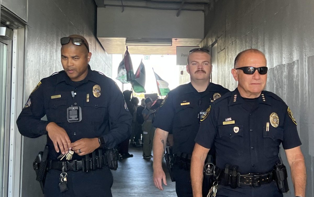 SDCCD Police walk in front of protestors  marching toward President Ricky Shabazz's office during the San Diego City College Student Walkout, Tuesday, May 7, 2024. Photo by Nadia Lavin/City Times Media