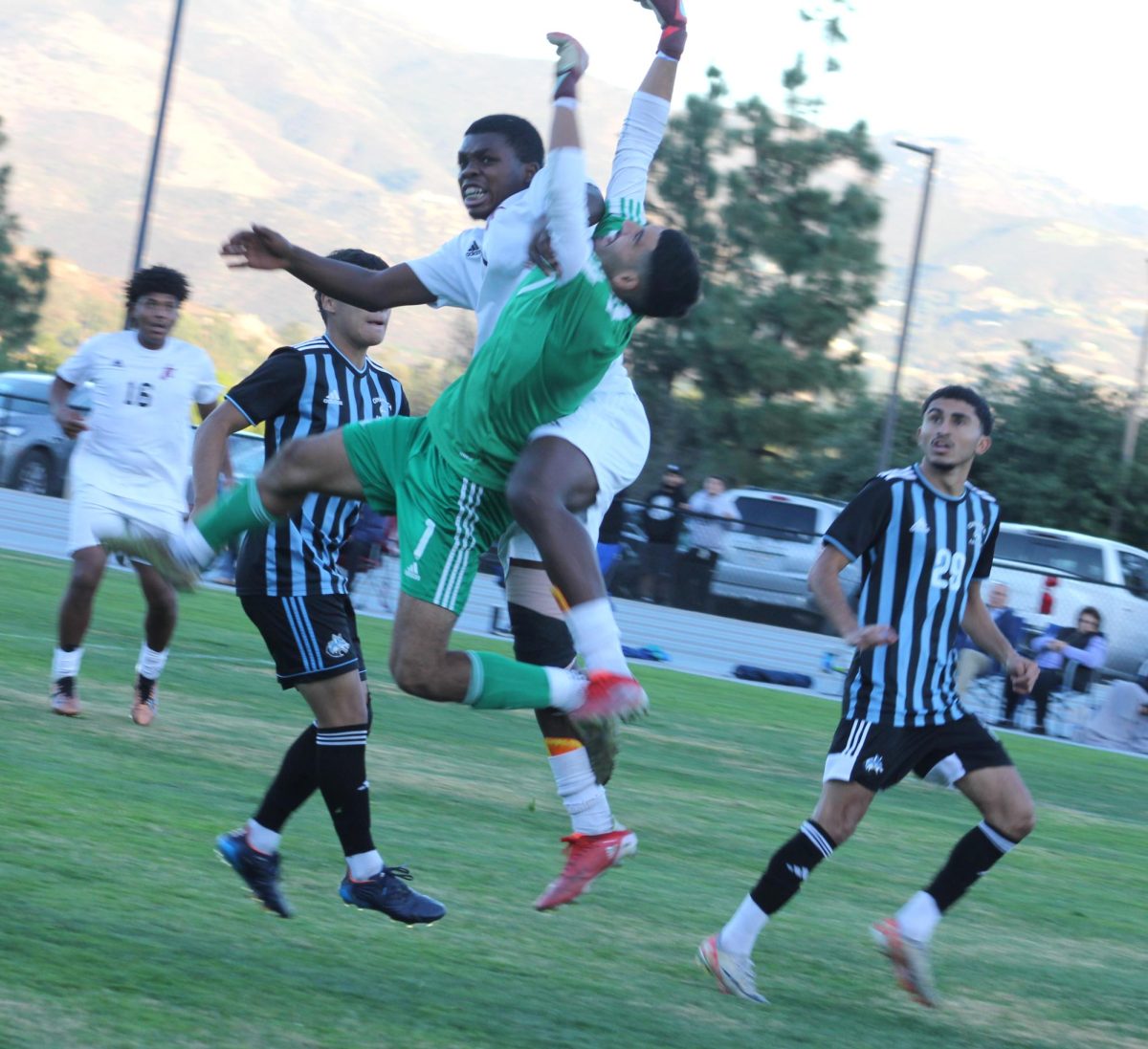 City College freshman forward Jamesley Exantus collides with Cuyamaca goalie Pablo Torres in first-half action against Cuyamaca at Cuyamaca College, Tuesday, Oct. 12, 2024. Photo by Danny Straus/City Times Media
